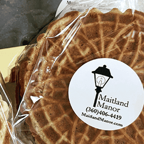 Freshly baked cookie butter pizzelles on a plate